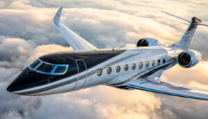 A sleek luxury private jet flying high above a sea of clouds during sunset, showcasing its modern design and elegance.